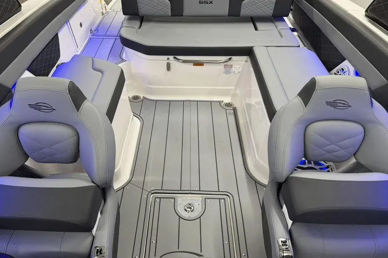 Slide: The Image of 2026 Chaparral SSX 6 boat interior with luxurious gray seating and modern design. - 25