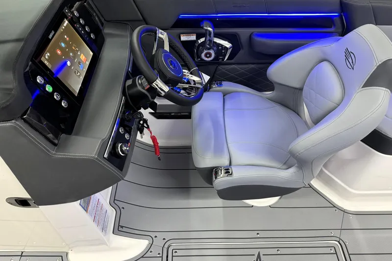 Slide: The Image of 2026 Chaparral SSX 6 boat interior with modern dashboard and luxurious seating. - 14