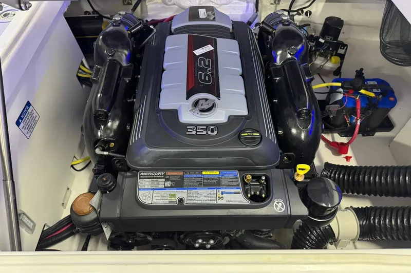 Slide: The Image of Engine compartment of 2026 Chaparral SSX 6 boat featuring a Mercury 6.2L 350 engine. - 31