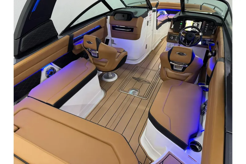 Slide: The Image of Luxurious interior of 2026 Chaparral SSX 6 boat with tan leather seating and modern dashboard. - 14