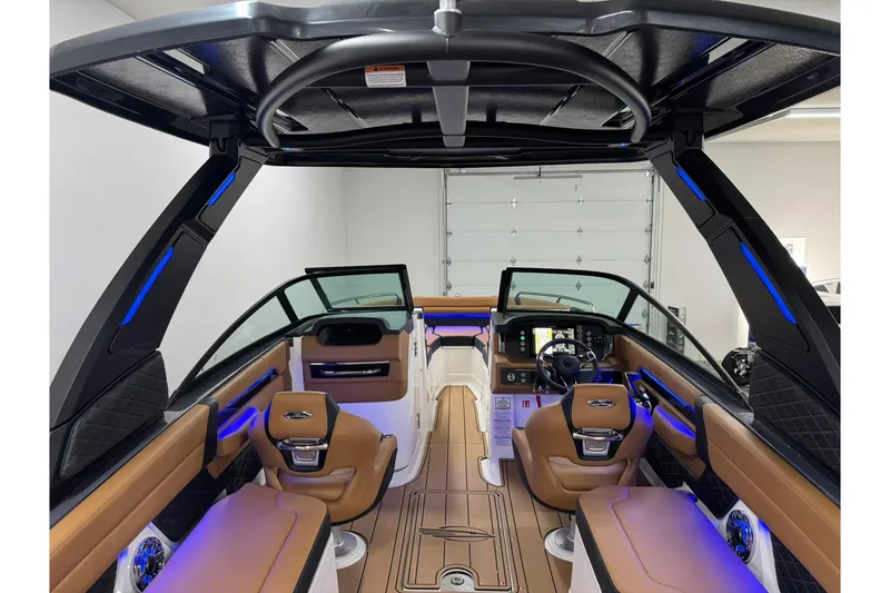 Slide: The Image of Interior of 2026 Chaparral SSX 6 boat with modern design and blue lighting. - 15