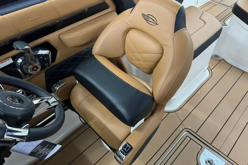 Slide: The Image of 2026 Chaparral SSX 6 boat interior with tan and black leather seating. - 22