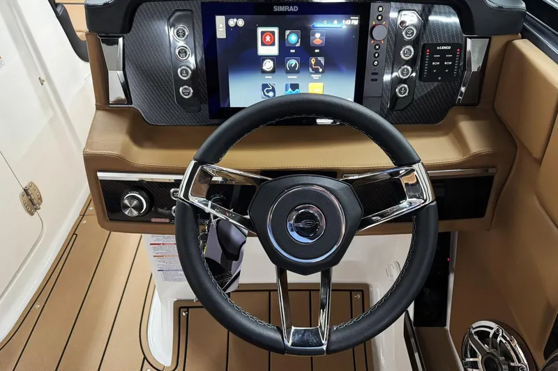 Slide: The Image of Steering wheel and dashboard of 2026 Chaparral SSX 6 boat with touchscreen display. - 24