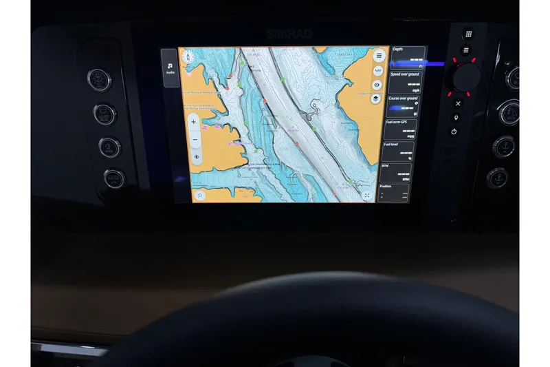Slide: The Image of Dashboard navigation screen of 2026 Chaparral SSX 6 boat displaying nautical map. - 26
