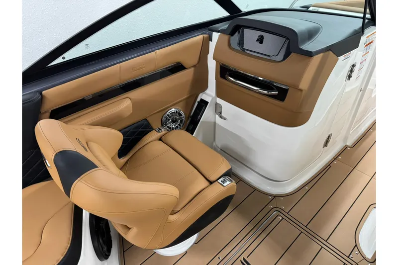 Slide: The Image of 2026 Chaparral SSX 6 boat interior with tan leather seating and modern design. - 28