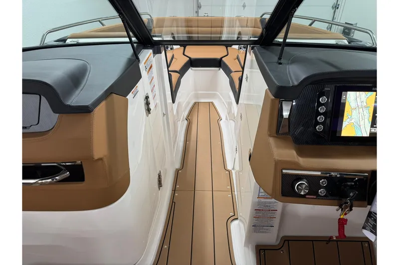 Slide: The Image of Interior view of 2026 Chaparral SSX 6 boat, featuring sleek design and modern navigation system. - 35
