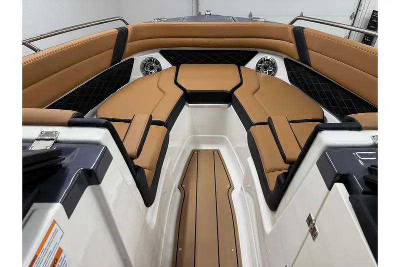 Slide: The Image of 2026 Chaparral SSX 6 boat interior with tan and black seating, modern design. - 38
