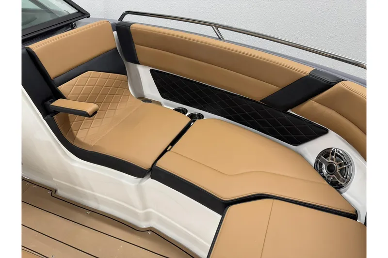 Slide: The Image of Luxurious tan and black seating in 2026 Chaparral SSX 6 boat interior. - 41