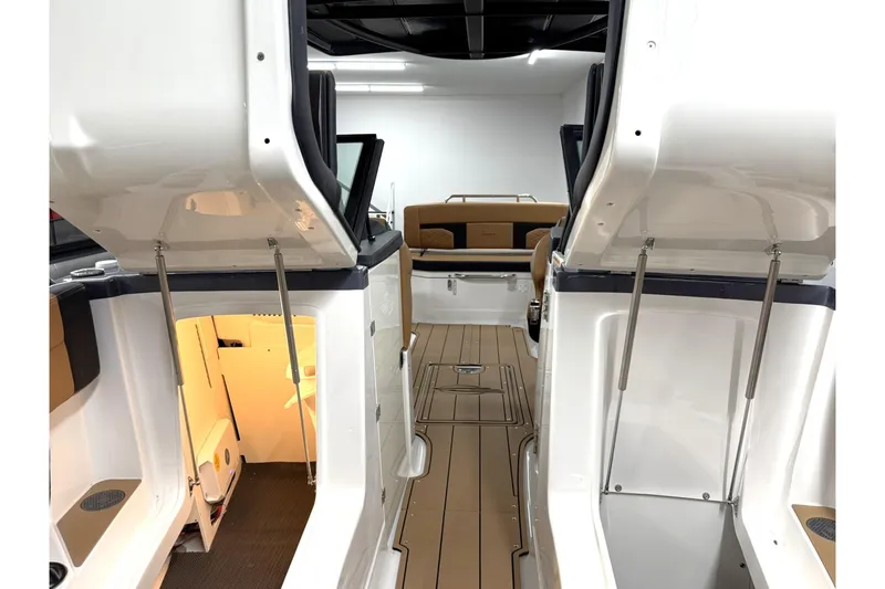 Slide: The Image of 2026 Chaparral SSX 6 boat interior with open storage compartments and sleek design. - 43