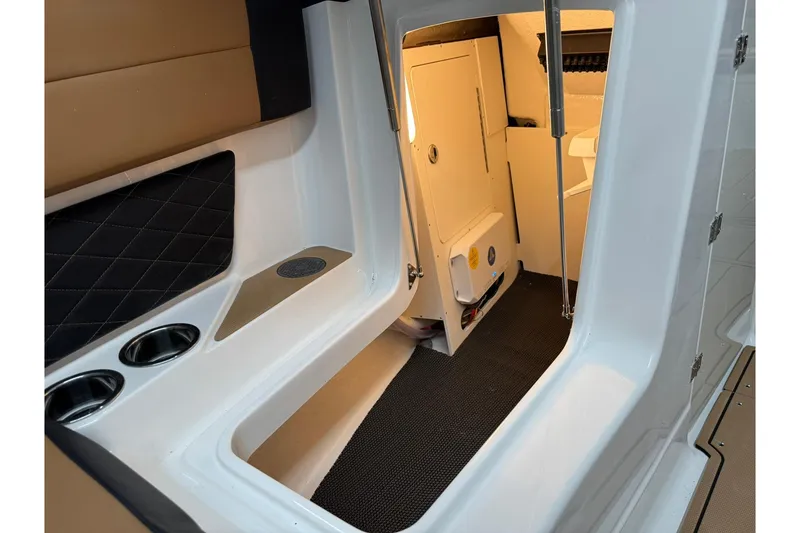 Slide: The Image of Interior cabin of 2026 Chaparral SSX 6 boat with seating and storage. - 45