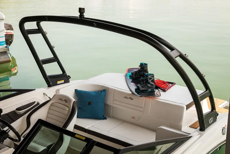 Slide: The Image of Manufacturer Provided Image: 2020 Sea Ray SPX 190 boat interior with wakeboard and cushion. - 11