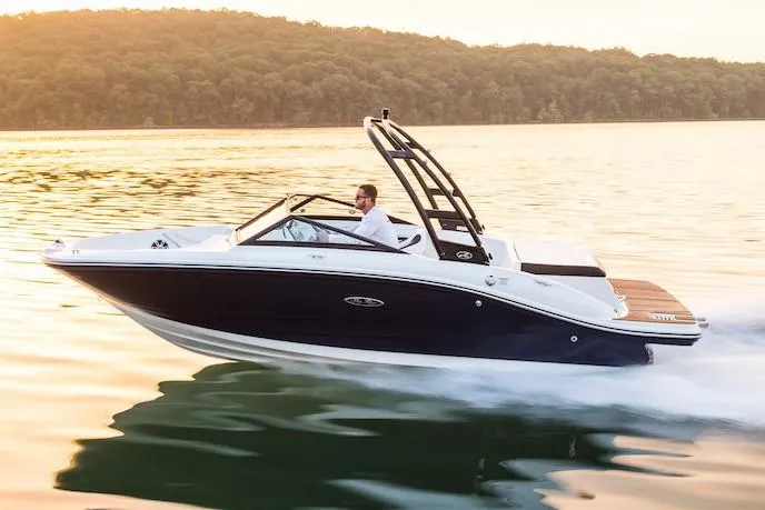 Slide: The Image of Manufacturer Provided Image: 2020 Sea Ray SPX 190 boat cruising on a lake at sunset. - 2