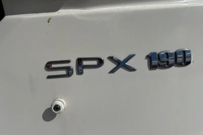 Slide: The Image of Close-up of 2021 Sea Ray 19 SPX OB boat emblem on white surface. - 20