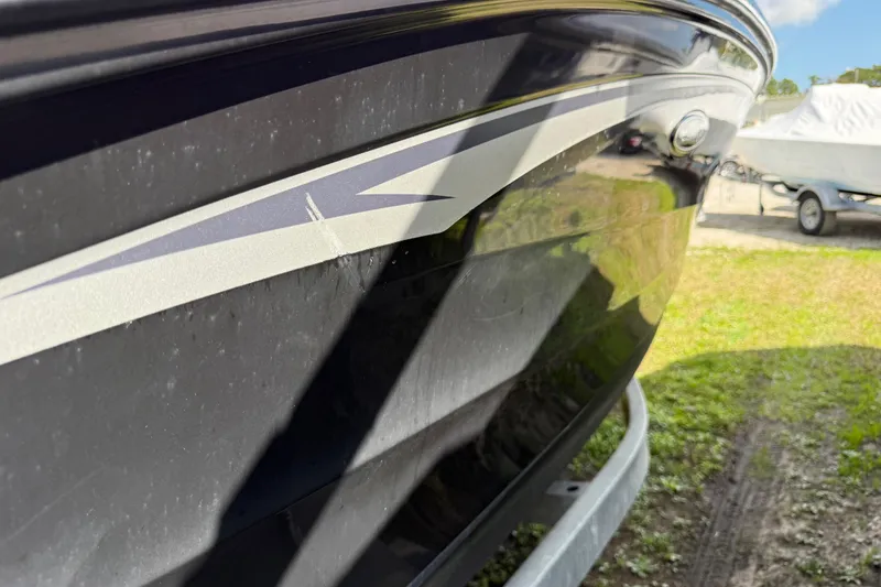 Slide: The Image of 2021 Sea Ray 19 SPX OB boat hull with sleek design and reflective finish. - 27