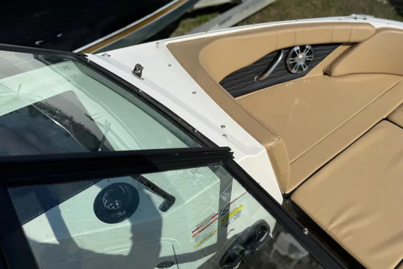 Slide: The Image of 2021 Sea Ray 19 SPX OB boat interior with tan seating and speaker detail. - 3