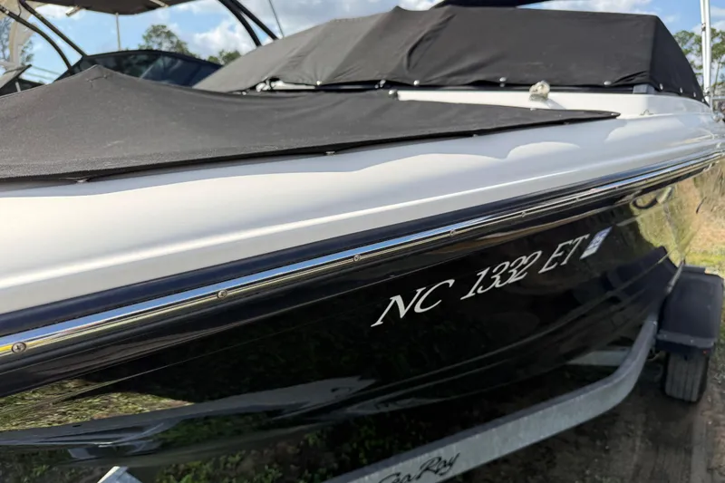 Slide: The Image of 2021 Sea Ray 19 SPX OB boat with cover, on trailer, side view. - 30