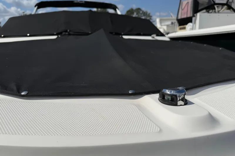 Slide: The Image of 2021 Sea Ray 19 SPX OB boat with black cover, close-up view. - 31