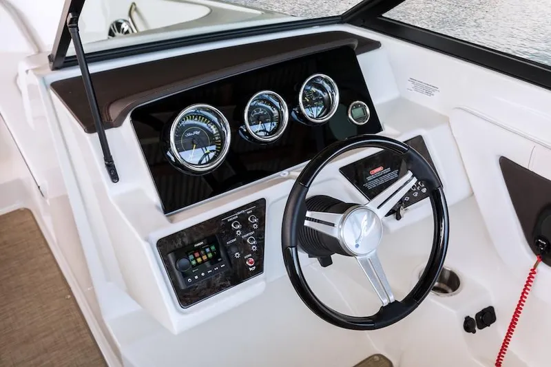 Slide: The Image of Manufacturer Provided Image: 2020 Sea Ray SPX 190 boat dashboard with steering wheel and gauges. - 8