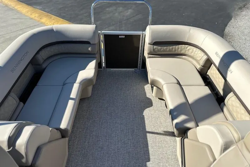 Slide: The Image of 2026 Bennington 22 S Quad Bench interior with luxurious seating and modern design. - 4