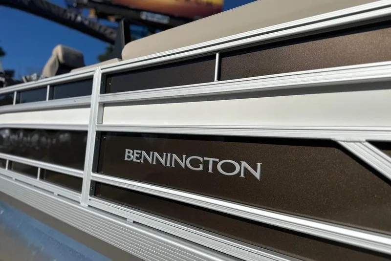 Slide: The Image of 2026 Bennington 22 S Quad Bench pontoon boat with sleek design details. - 5