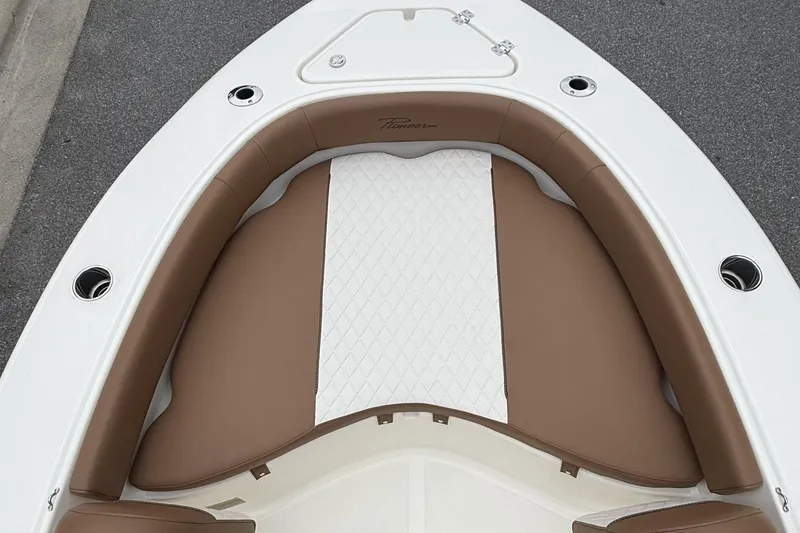 Slide: The Image of 2026 Pioneer 180 Islander boat with brown and white cushioned seating. - 3