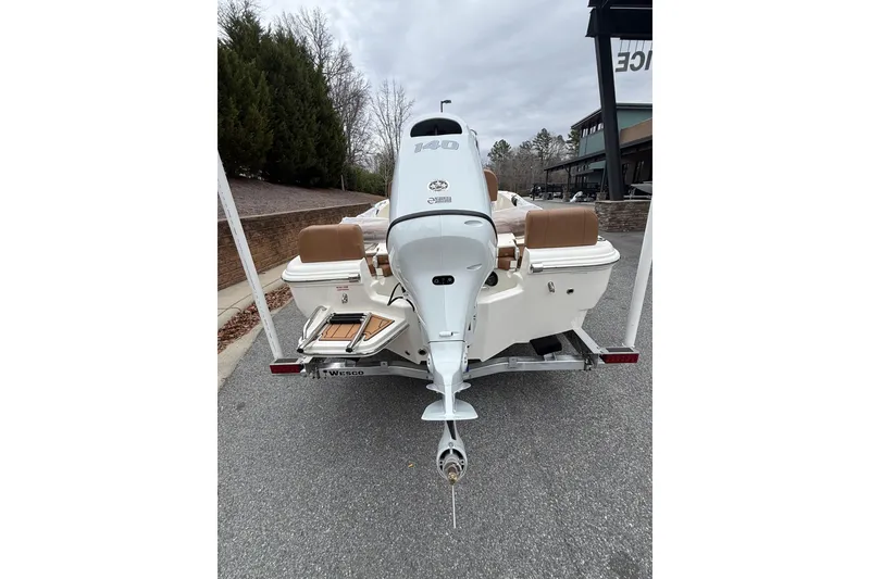 Slide: The Image of 2026 Pioneer 180 Islander boat with outboard motor on trailer. - 9