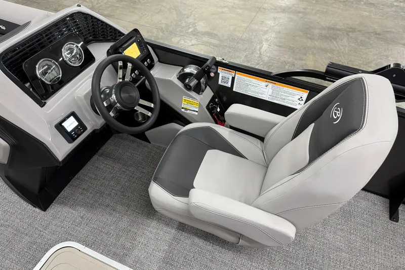 Slide: The Image of 2026 Barletta ARIA 22UC boat cockpit with modern steering and comfortable seating. - 11