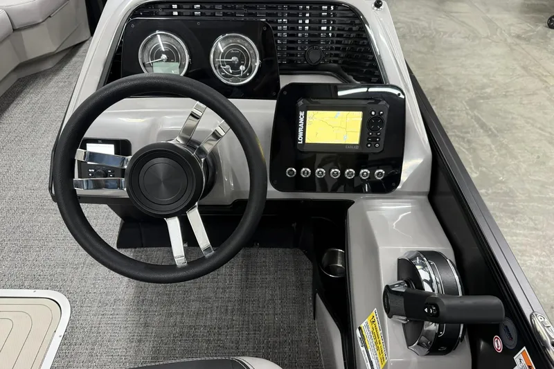 Slide: The Image of 2026 Barletta ARIA 22UC boat dashboard with steering wheel and navigation system. - 13