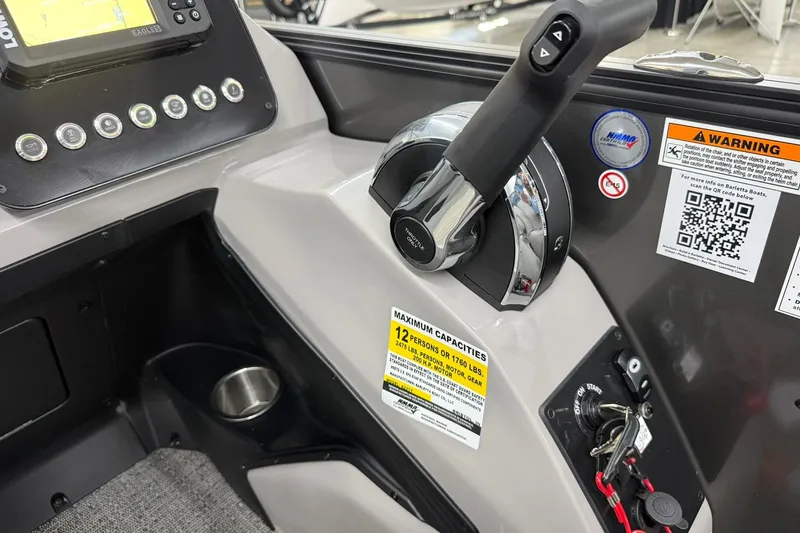Slide: The Image of Control panel of 2026 Barletta ARIA 22UC boat with throttle and warning labels. - 14