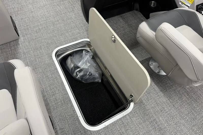 Slide: The Image of 2026 Barletta ARIA 22UC boat interior with open storage compartment and seating. - 19