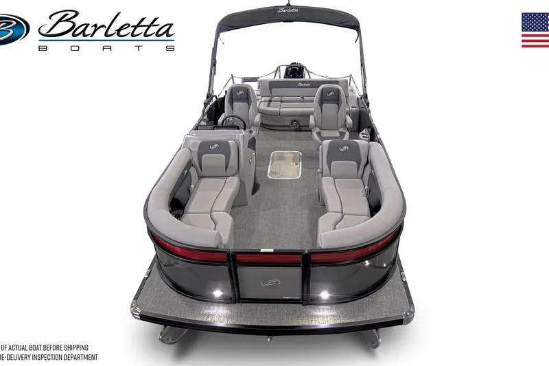 Slide: The Image of 2026 Barletta ARIA 22UC pontoon boat with Mercury outboard motor in showroom. - 2