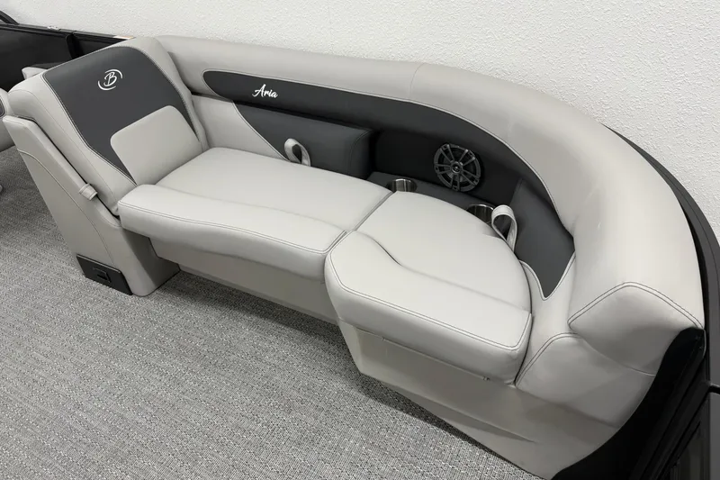 Slide: The Image of 2026 Barletta ARIA 22UC boat interior with plush seating and integrated speaker system. - 23