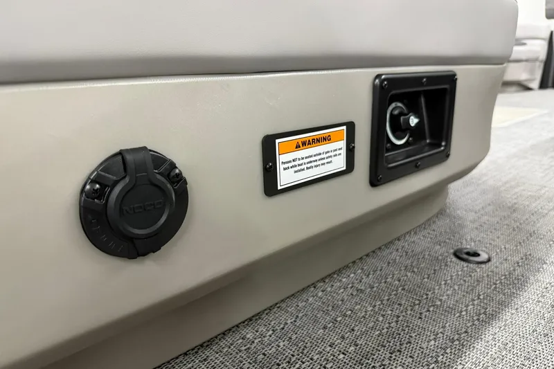 Slide: The Image of 2026 Barletta ARIA 22UC boat interior detail with warning label and NOCO port. - 26