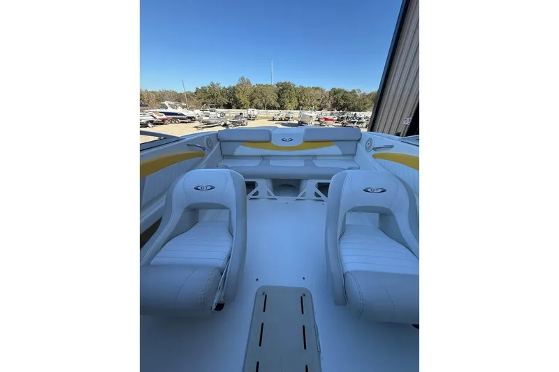 Slide: The Image of 2008 Glastron GX 205 boat interior with white and yellow seating. - 4