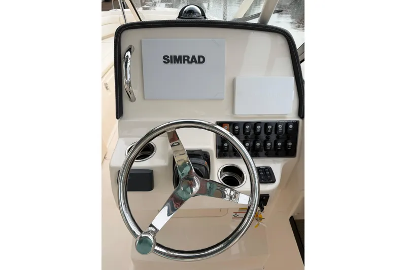 Slide: The Image of Simrad marine display on 2019 Grady-White Freedom 235, showing navigation and sonar data. - 16