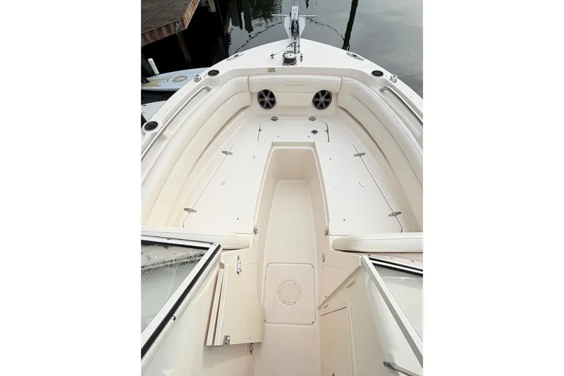 Slide: The Image of 2019 Grady-White Freedom 235 boat interior with spacious seating and storage compartments. - 18