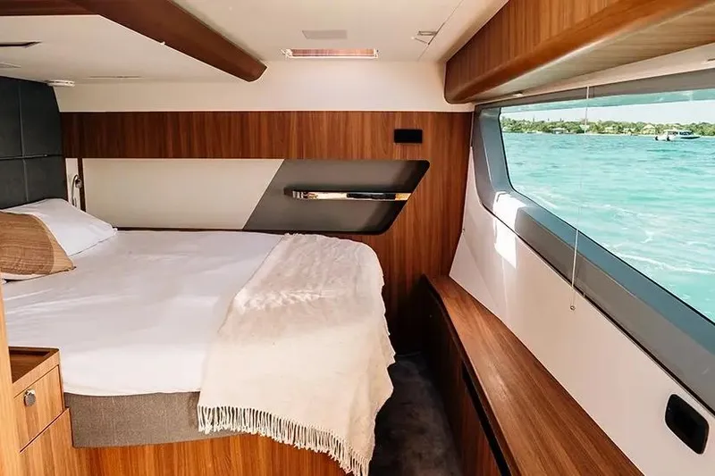 Slide: The Image of Manufacturer Provided Image: Luxurious interior of 2026 Aquila 46 Coupe yacht with scenic ocean view. - 10