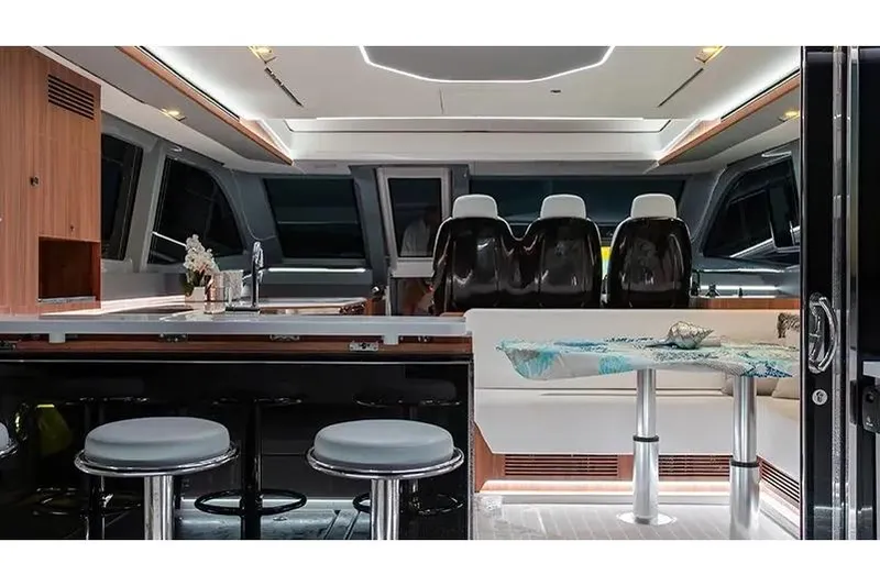 Slide: The Image of Manufacturer Provided Image: Interior of 2026 Aquila 46 Coupe yacht, featuring modern seating and sleek design elements. - 4