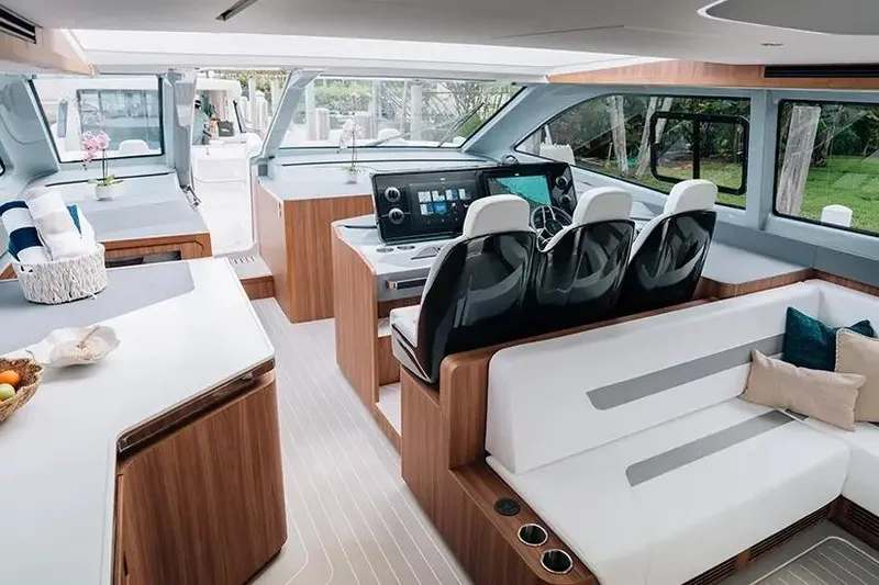 Slide: The Image of Manufacturer Provided Image: Luxurious interior of 2026 Aquila 46 Coupe yacht with modern seating and navigation controls. - 6