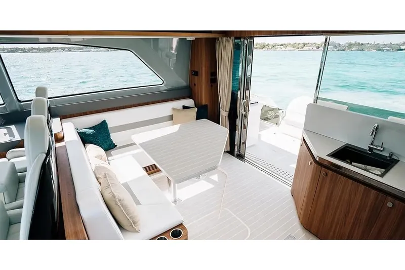 Slide: The Image of Manufacturer Provided Image: Luxurious interior of 2026 Aquila 46 Coupe yacht with modern seating and ocean view. - 7