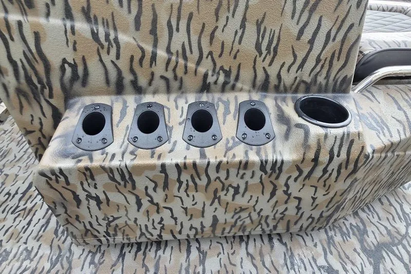 Slide: The Image of Camouflage-patterned console with rod holders on 2026 Xpress H20B Bay boat. - 15