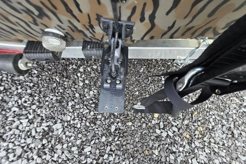 Slide: The Image of Transom of 2026 Xpress H20B Bay boat with Garmin equipment on gravel. - 7