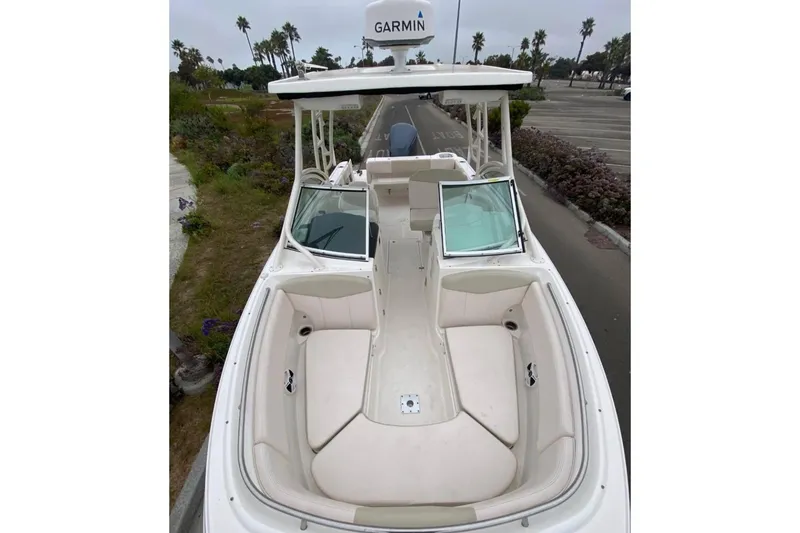 Slide: The Image of 2017 Robalo R247 Dual Console boat with open seating and Garmin equipment. - 10