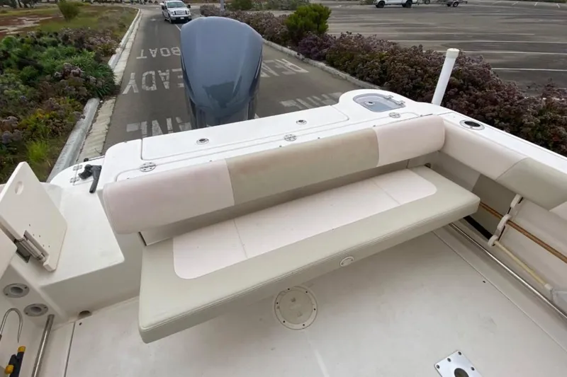 Slide: The Image of 2017 Robalo R247 Dual Console boat with rear seating and outboard motor. - 11