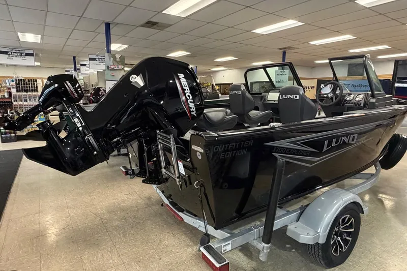 Slide: The Image of 2026 Lund 1700 Explorer Sport boat on trailer in showroom. - 3