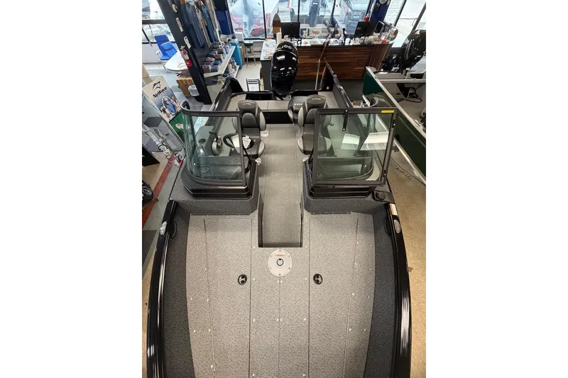 Slide: The Image of 2026 Lund 1700 Explorer Sport Outfitter Edition boat on trailer, featuring Mercury engine. - 5