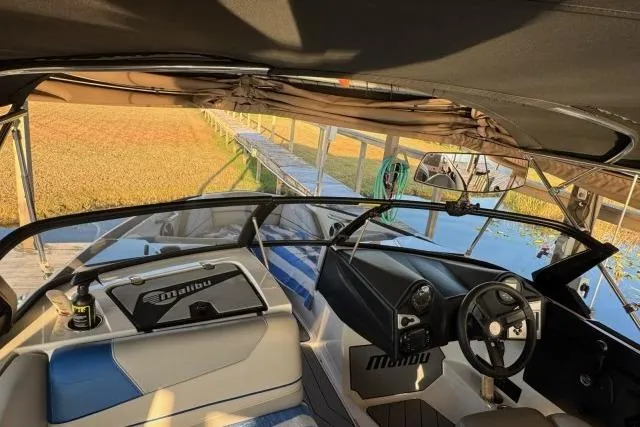 Slide: The Image of 2017 Malibu Response TXi Open Bow boat interior with steering wheel and seating. - 3