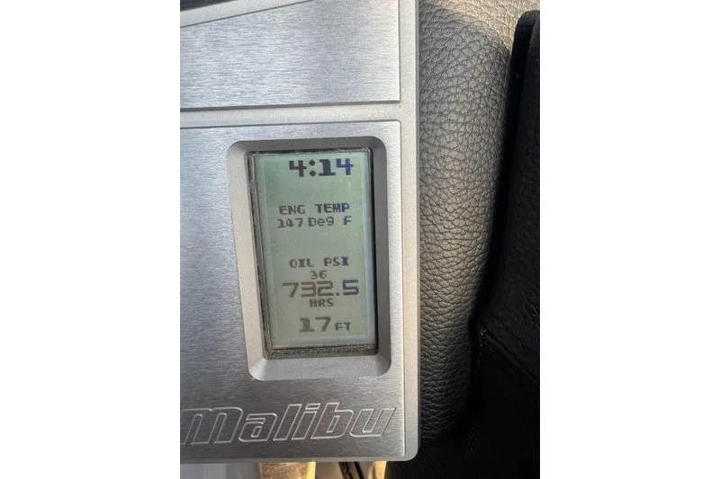 Slide: The Image of Dashboard display of a 2017 Malibu Response TXi Open Bow boat showing engine metrics. - 6