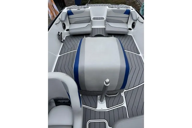 Slide: The Image of 2017 Malibu Response TXi Open Bow interior with gray and blue seating. - 7