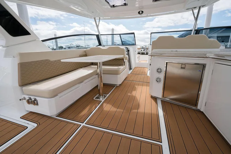 Slide: The Image of Manufacturer Provided Image: 2026 Aquila 36 Sport yacht interior with seating, table, and kitchenette. - 9